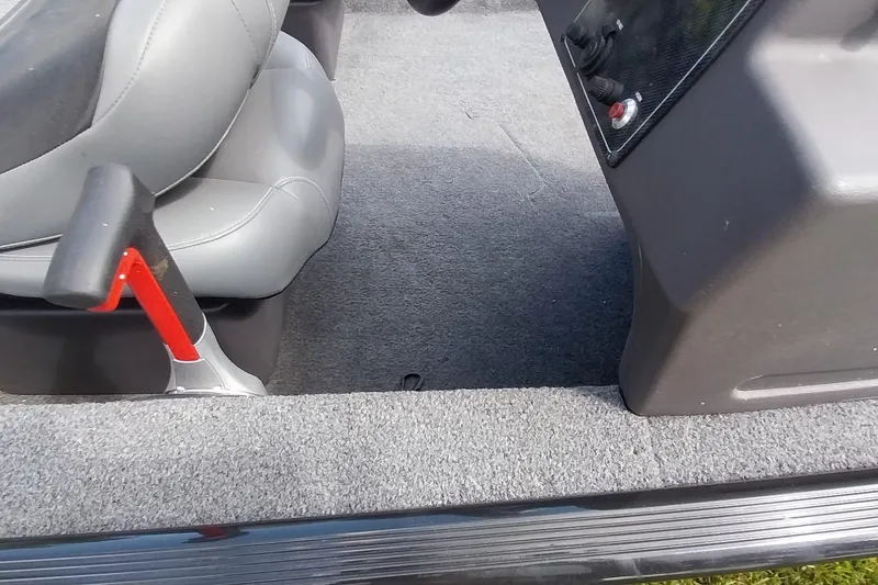 Slide: The Image of 2023 Tracker Bass Tracker Classic XL interior with gray seating and control panel. - 11