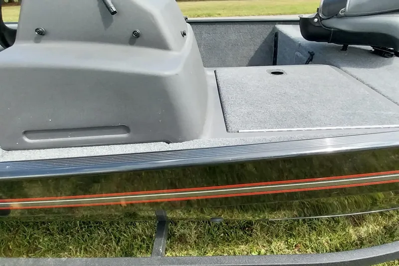 Slide: The Image of 2023 Tracker Bass Tracker Classic XL boat interior with seating and storage compartments. - 12