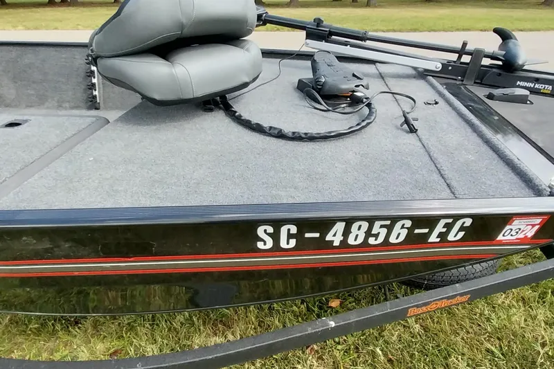 Slide: The Image of 2023 Tracker Bass Tracker Classic XL boat with registration SC-4856-EC, gray seating, and Minn Kota trolling motor. - 13