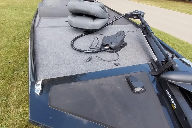 Slide: The Image of 2023 Tracker Bass Tracker Classic XL boat deck with seats and trolling motor. - 15