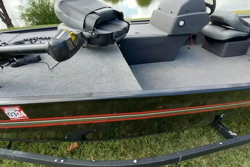 Slide: The Image of 2023 Tracker Bass Tracker Classic XL boat interior with seating and control console. - 16