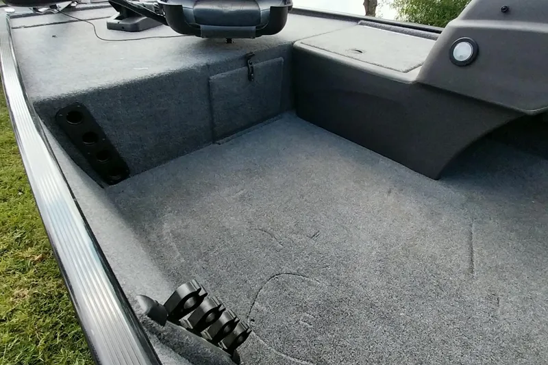 Slide: The Image of 2023 Tracker Bass Tracker Classic XL boat interior with carpeted deck and storage compartments. - 18