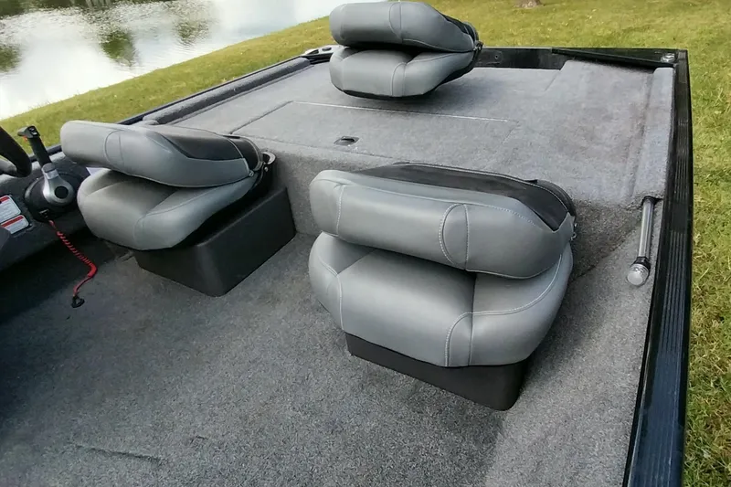 Slide: The Image of 2023 Tracker Bass Tracker Classic XL boat interior with gray cushioned seats. - 19