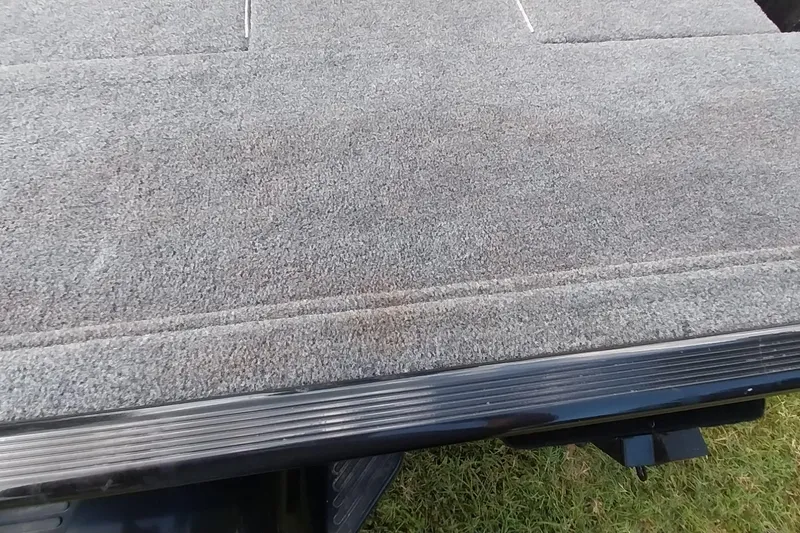 Slide: The Image of 2023 Tracker Bass Tracker Classic XL boat deck with gray carpet finish. - 22