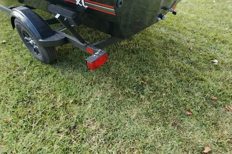 Slide: The Image of 2023 Tracker Bass Tracker Classic XL trailer on grass, rear view. - 5