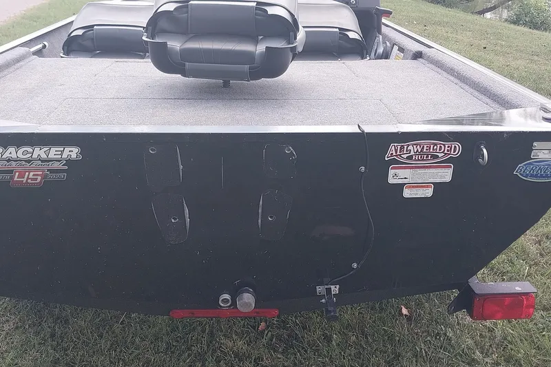 Slide: The Image of 2023 Tracker Bass Tracker Classic XL boat rear view, featuring all-welded hull design. - 6