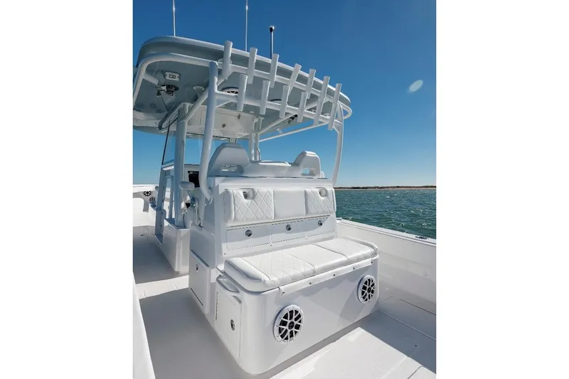 Slide: The Image of 2024 Onslow Bay 37 Offshore boat interior with seating and ocean view. - 11