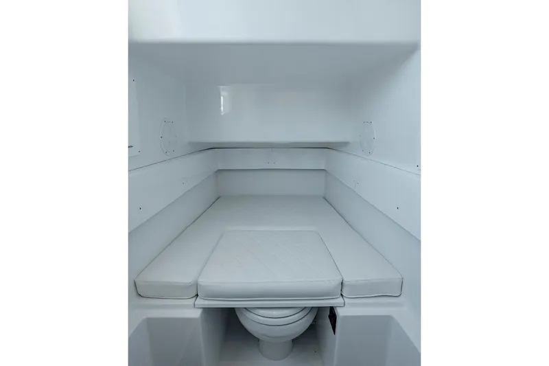 Slide: The Image of 2024 Onslow Bay 37 Offshore cabin interior with cushioned seating and compact design. - 12