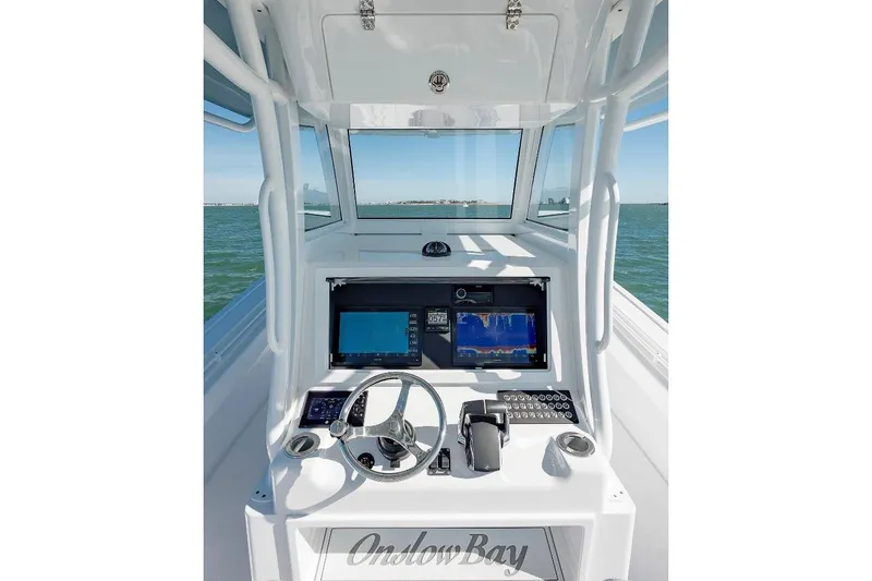 Slide: The Image of 2024 Onslow Bay 37 Offshore boat helm with advanced navigation displays. - 6