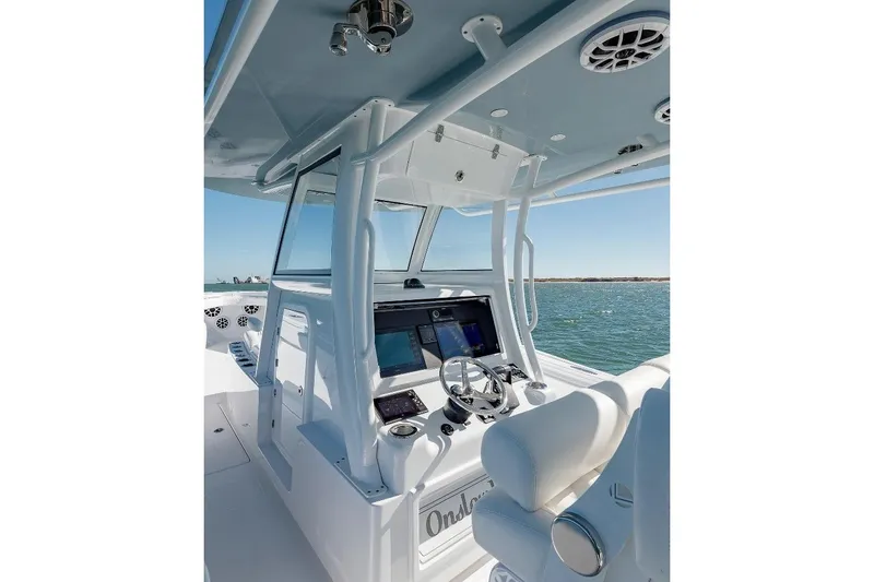 Slide: The Image of 2024 Onslow Bay 37 Offshore boat cockpit with modern controls and ocean view. - 7