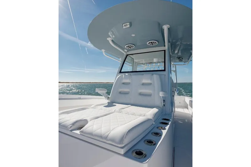 Slide: The Image of 2024 Onslow Bay 37 Offshore boat with luxurious seating and ocean backdrop. - 9