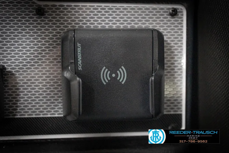 Slide: The Image of Wireless charging station on 2026 Lund 2275 Baron boat dashboard. - 41
