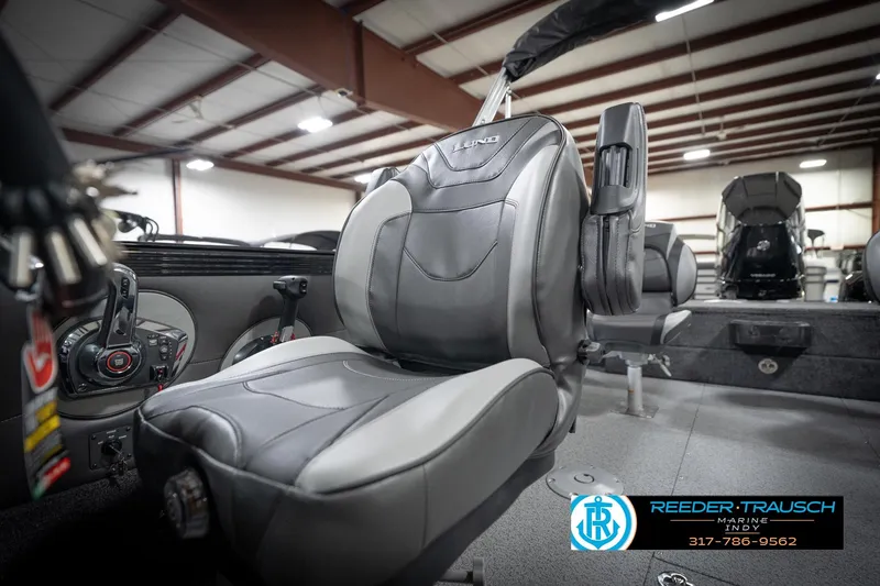 Slide: The Image of 2026 Lund 2275 Baron boat interior with premium seating and control panel. - 44