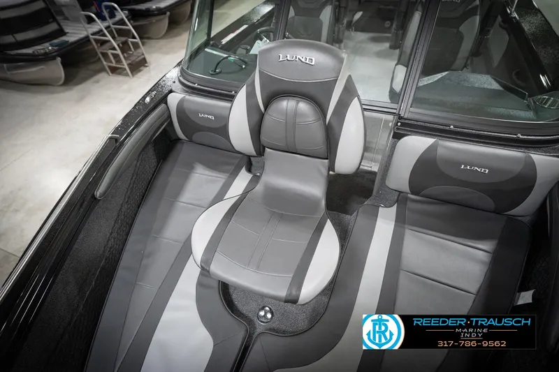 Slide: The Image of Interior of 2026 Lund 2275 Baron boat with sleek seating design. - 48