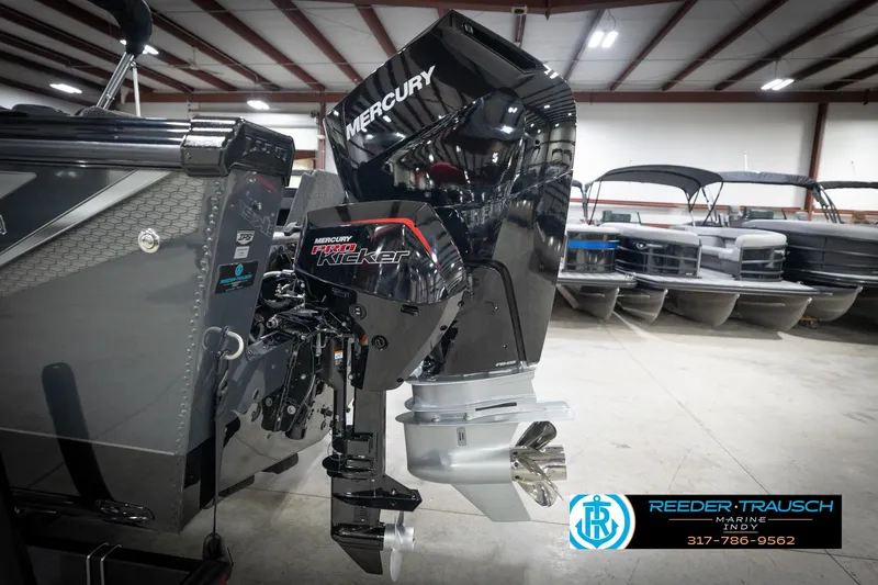 Slide: The Image of 2026 Lund 2275 Baron with Mercury Pro Kicker engine in showroom. - 54