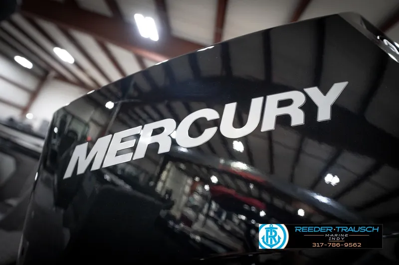 Slide: The Image of 2026 Lund 2275 Baron boat with Mercury engine in showroom. - 55