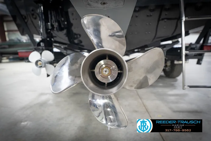 Slide: The Image of Close-up of a 2026 Lund 2275 Baron boat propeller in a showroom. - 58