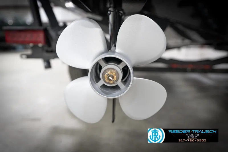 Slide: The Image of Close-up of a 2026 Lund 2275 Baron boat propeller in a showroom. - 62