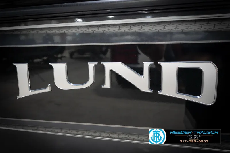 Slide: The Image of Close-up of Lund 2275 Baron 2026 logo on a sleek black surface. - 63