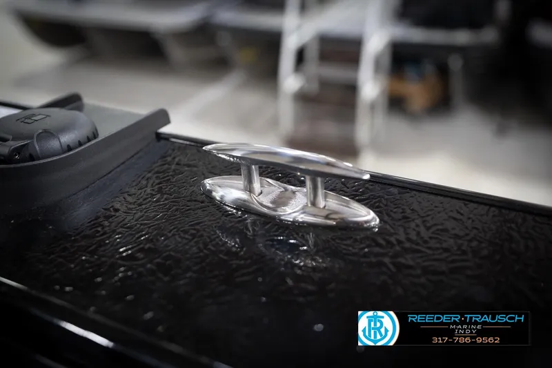 Slide: The Image of 2026 Lund 2275 Baron boat cleat detail, featuring sleek chrome finish. - 70