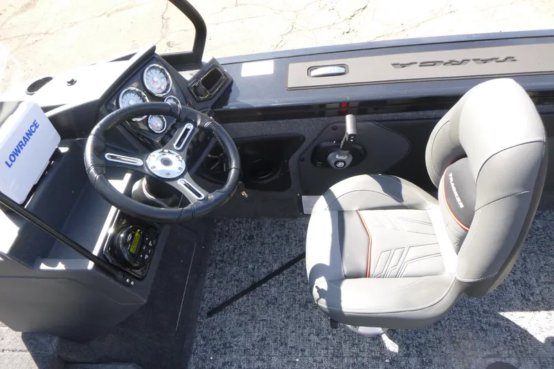 Slide: The Image of 2026 Tracker Targa V-19 WT boat interior with steering wheel and seat. - 12