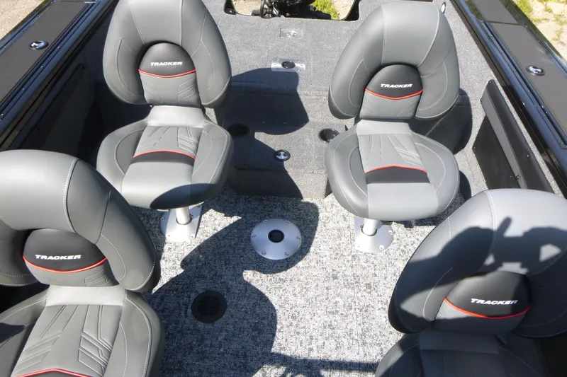 Slide: The Image of 2026 Tracker Targa V-19 WT boat interior with four gray seats. - 14