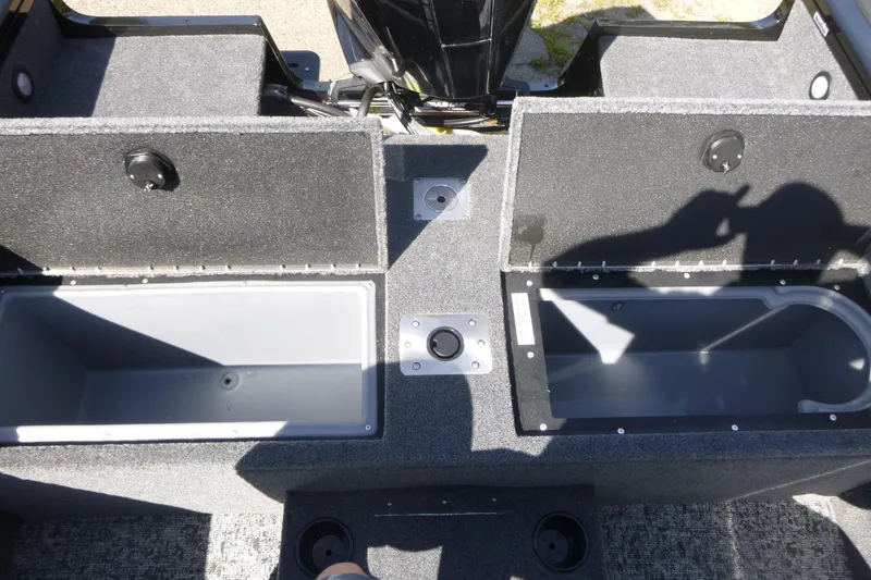 Slide: The Image of 2026 Tracker Targa V-19 WT boat interior with open storage compartments. - 15