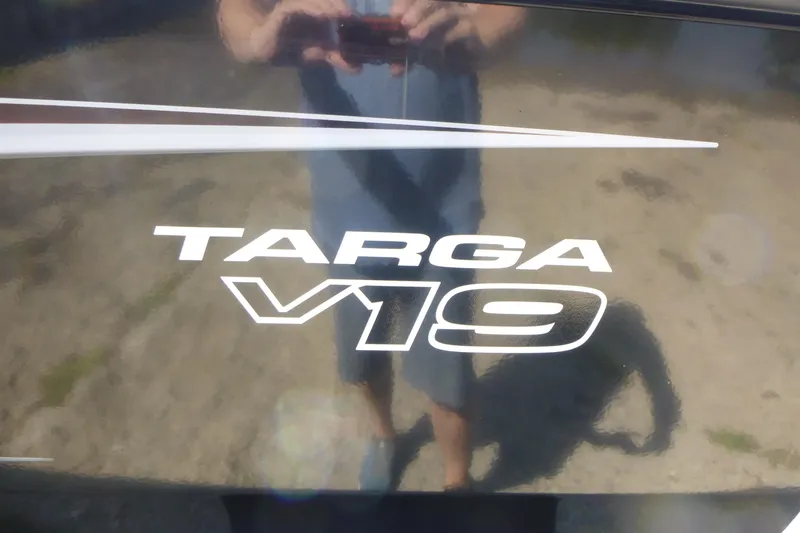 Slide: The Image of 2026 Tracker Targa V-19 WT logo on reflective surface. - 17