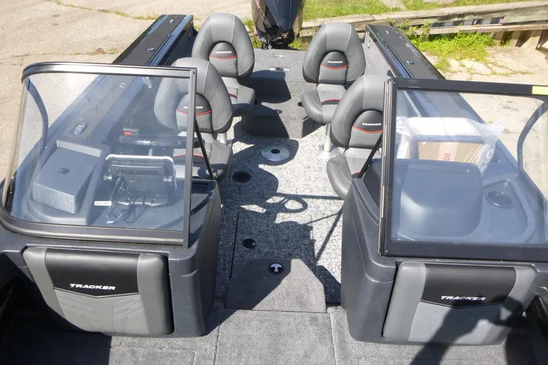 Slide: The Image of 2026 Tracker Targa V-19 WT boat interior with seating and dashboard view. - 6