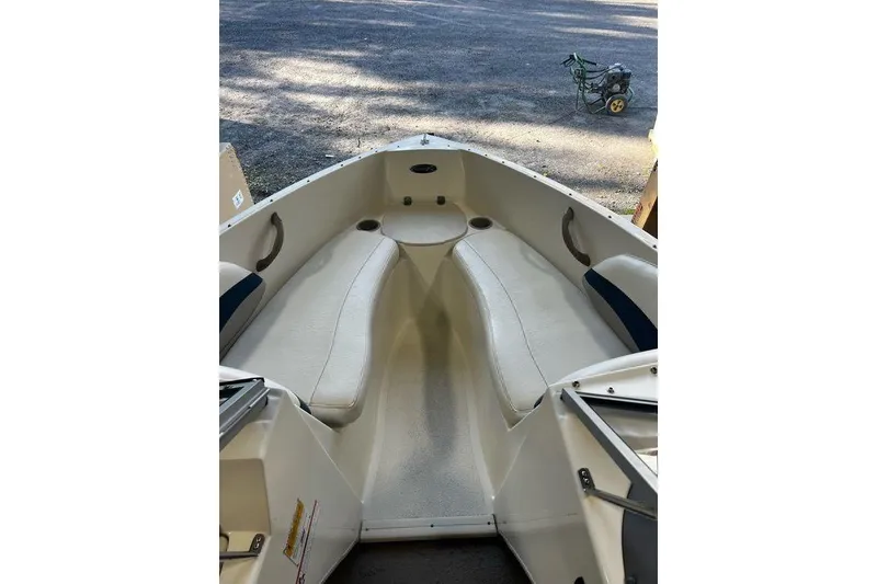 Slide: The Image of 2013 Stingray 195RX boat interior with seating and cup holders. - 6