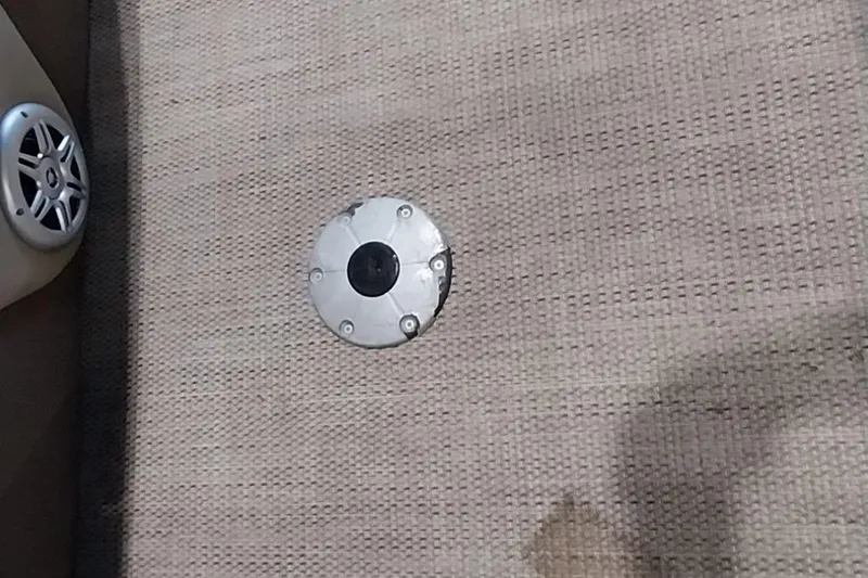 Slide: The Image of Speaker and floor mount on 2022 Regency 250 DL3 boat interior. - 25