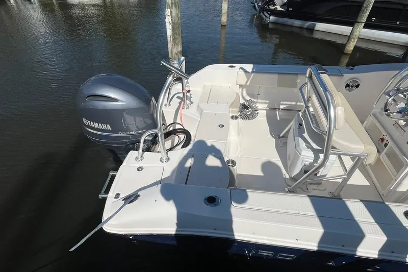 Slide: The Image of 2017 Robalo R200 Center Console boat with Yamaha outboard motor docked in marina. - 10