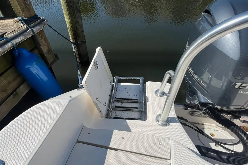 Slide: The Image of 2017 Robalo R200 Center Console boat with ladder and Yamaha outboard motor. - 12