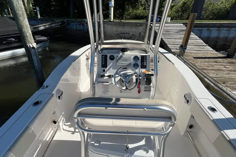 Slide: The Image of 2017 Robalo R200 Center Console boat interior with steering wheel and controls. - 13