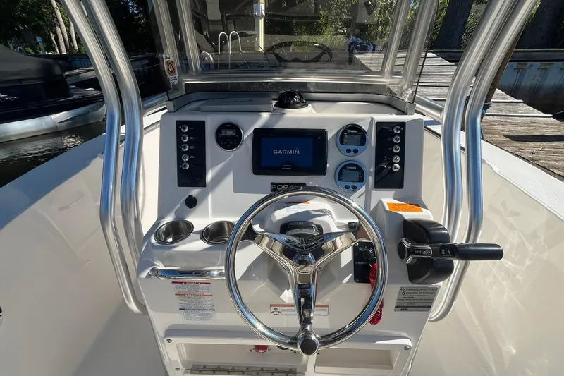 Slide: The Image of 2017 Robalo R200 Center Console boat dashboard with Garmin navigation system. - 14