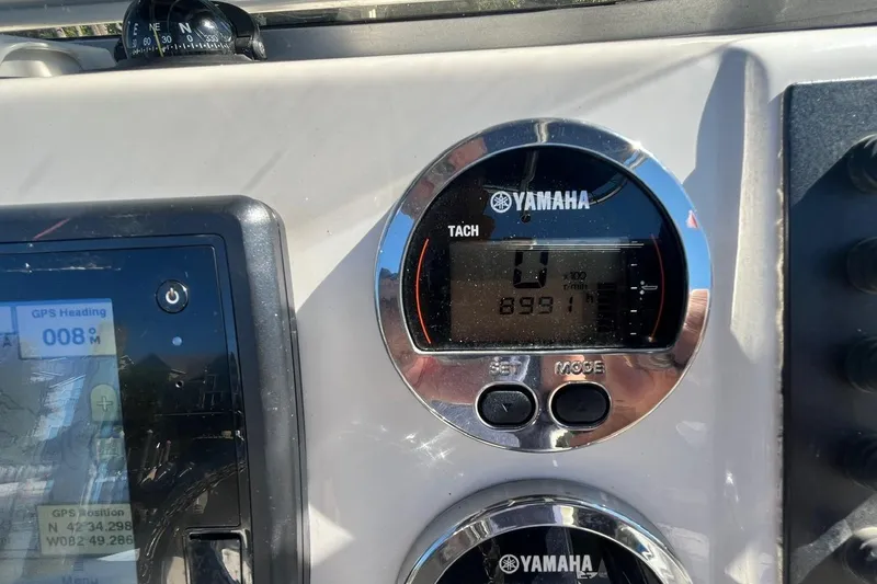 Slide: The Image of Dashboard of 2017 Robalo R200 Center Console with Yamaha tachometer and GPS display. - 16
