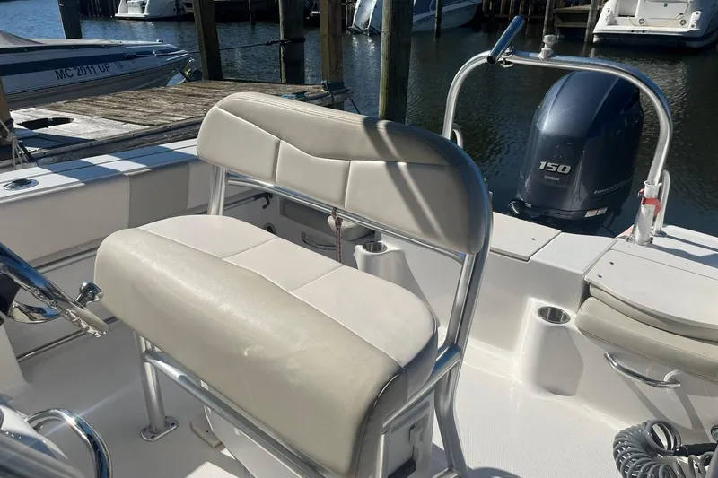 Slide: The Image of 2017 Robalo R200 Center Console boat interior with seating and Yamaha 150 engine. - 17