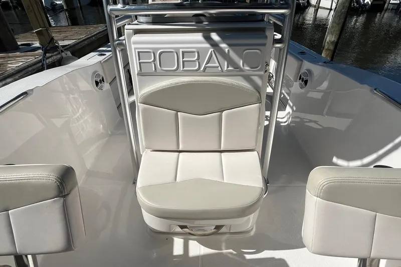 Slide: The Image of 2017 Robalo R200 Center Console boat interior with cushioned seating. - 18