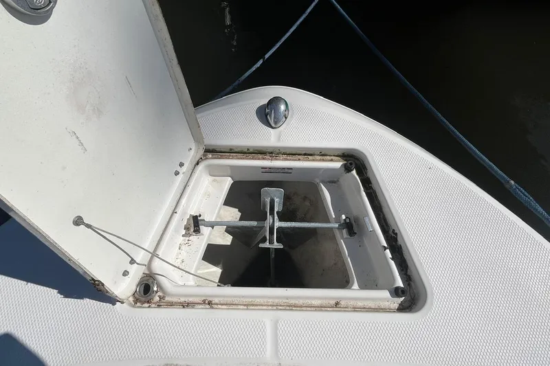Slide: The Image of 2017 Robalo R200 Center Console anchor compartment open on deck. - 20