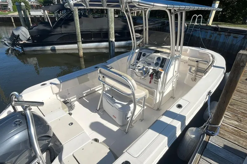Slide: The Image of 2017 Robalo R200 Center Console boat docked at marina, featuring sleek design and modern controls. - 5