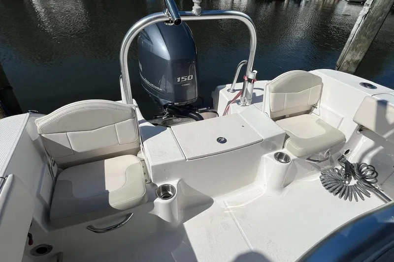 Slide: The Image of 2017 Robalo R200 Center Console boat interior with seating and Yamaha 150 engine. - 9