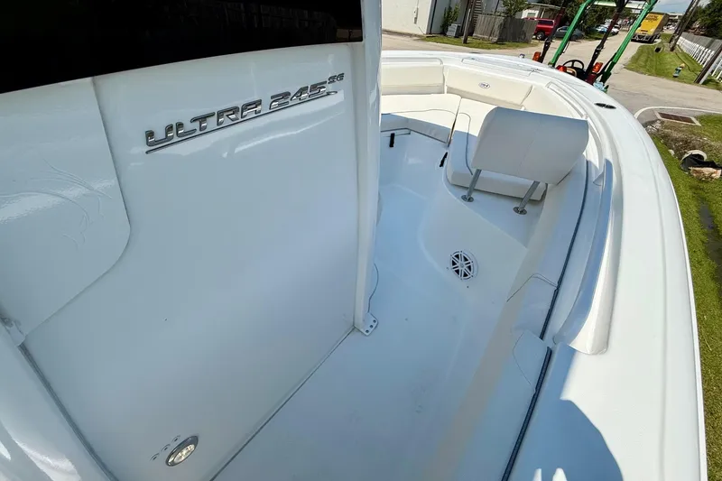Slide: The Image of 2026 Sea Hunt Ultra 245 SE boat interior, featuring sleek white seating and modern design. - 15