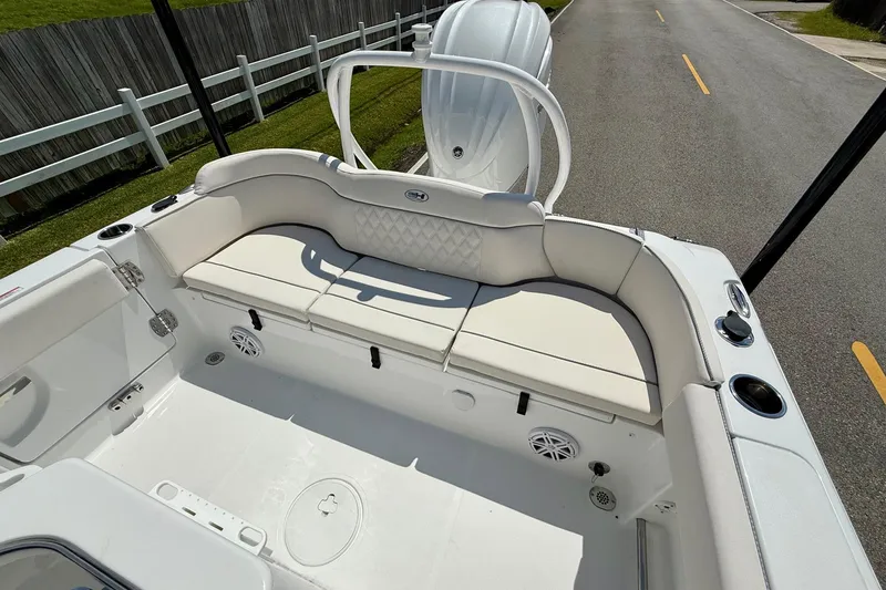 Slide: The Image of 2026 Sea Hunt Ultra 245 SE boat interior with white seating and modern design. - 7