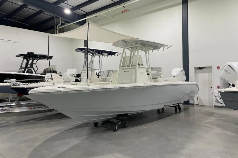 The Image of 2026 Pathfinder 2400 TRS boat displayed indoors, featuring sleek design and modern amenities. - 14