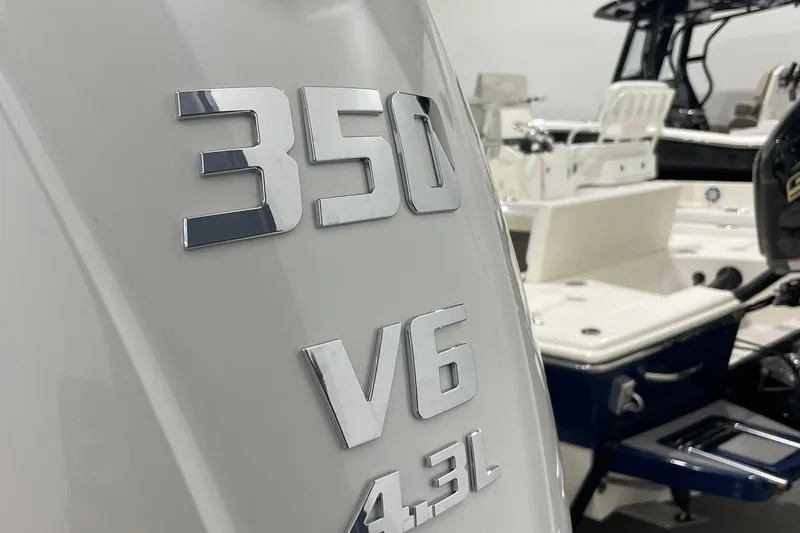 Slide: The Image of Close-up of 2026 Pathfinder 2400 TRS boat engine, featuring 350 V6 4.3L badge. - 17