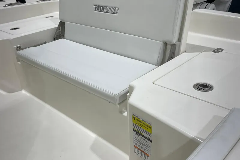 Slide: The Image of 2026 Pathfinder 2400 TRS boat interior with white seating and storage compartments. - 20