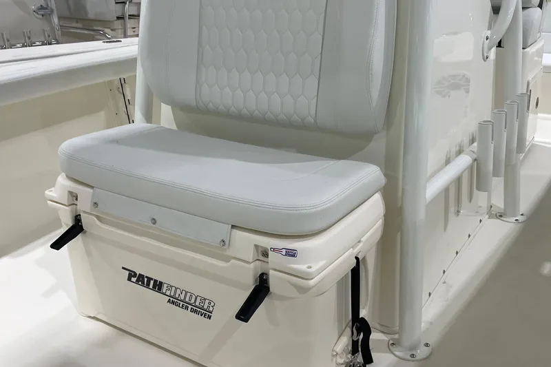 Slide: The Image of 2026 Pathfinder 2400 TRS boat seat with integrated cooler and rod holders. - 22