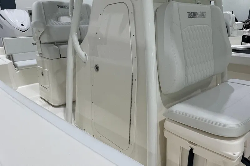 Slide: The Image of 2026 Pathfinder 2400 TRS boat interior with white seating and console details. - 27