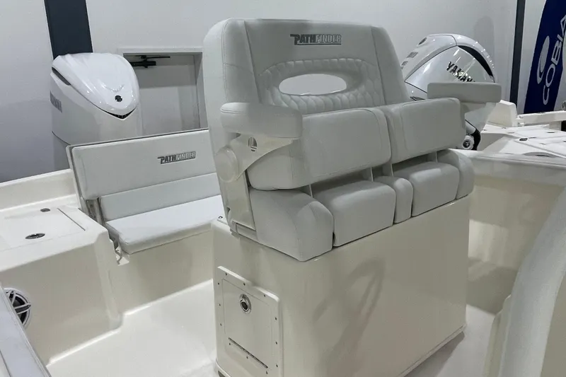 Slide: The Image of 2026 Pathfinder 2400 TRS boat interior with white seating and Yamaha outboard engines. - 28
