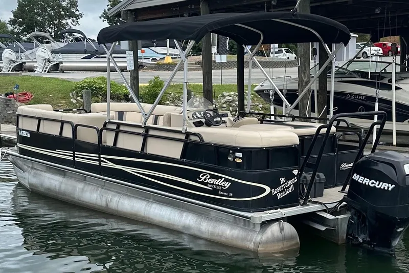 Slide: The Image of 2011 Bentley Pontoons 240 CRUISE boat docked with Mercury outboard motor. - 3